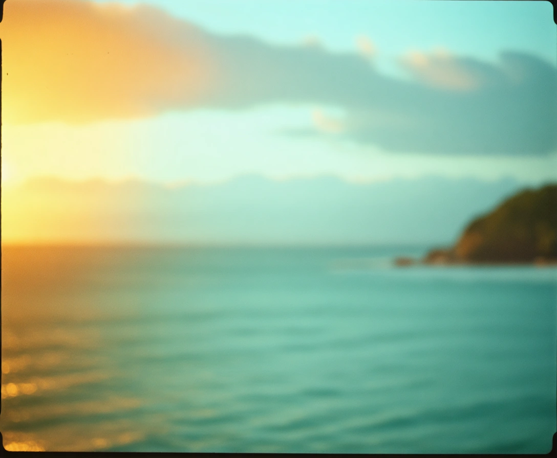 Woman smiling in golden light with ocean sunrise background